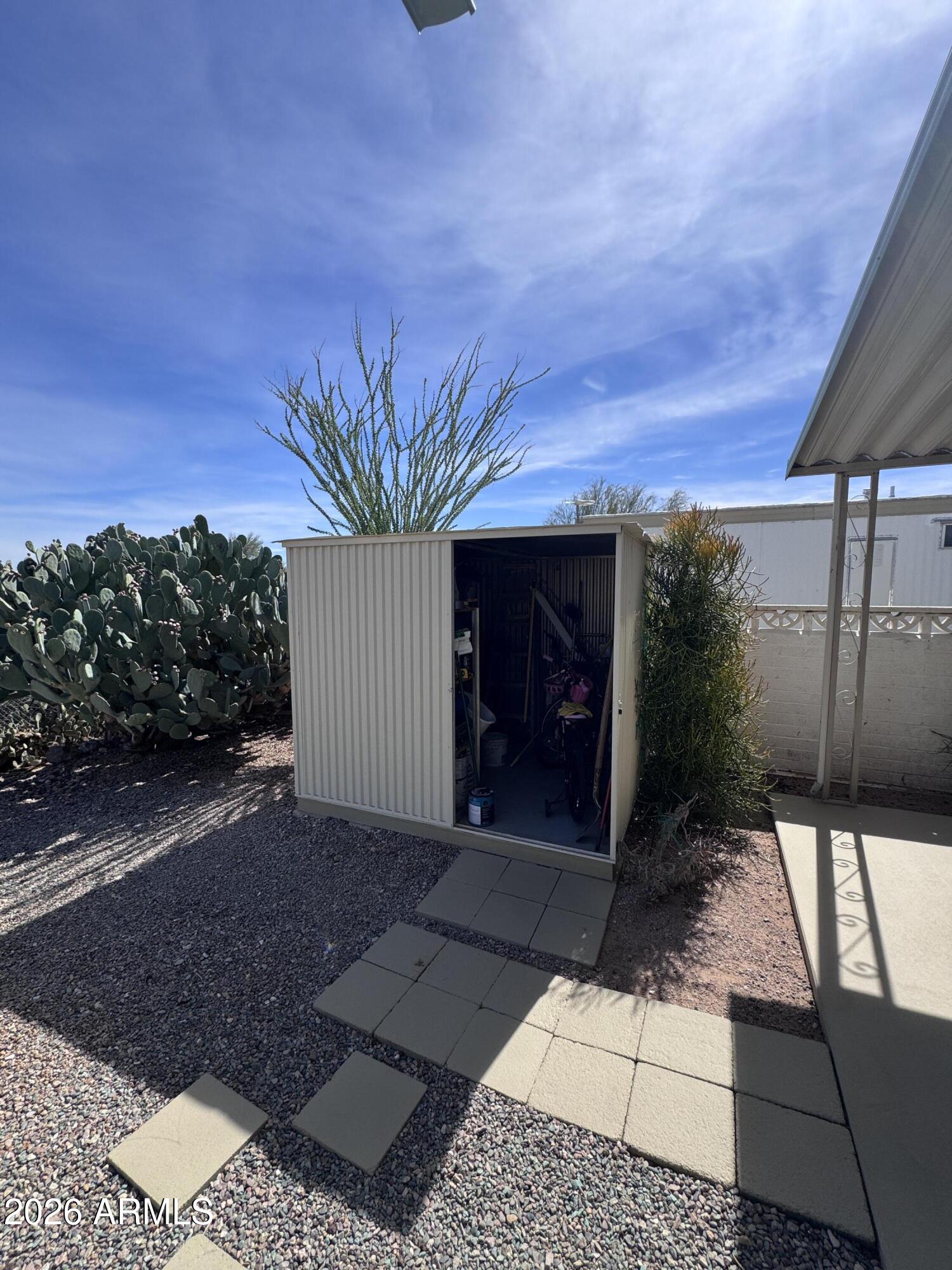 269 North Winchester Road, Unit 36 Apache Junction, AZ 85119 - Photo 18 of 19 a view of a house with a yard
