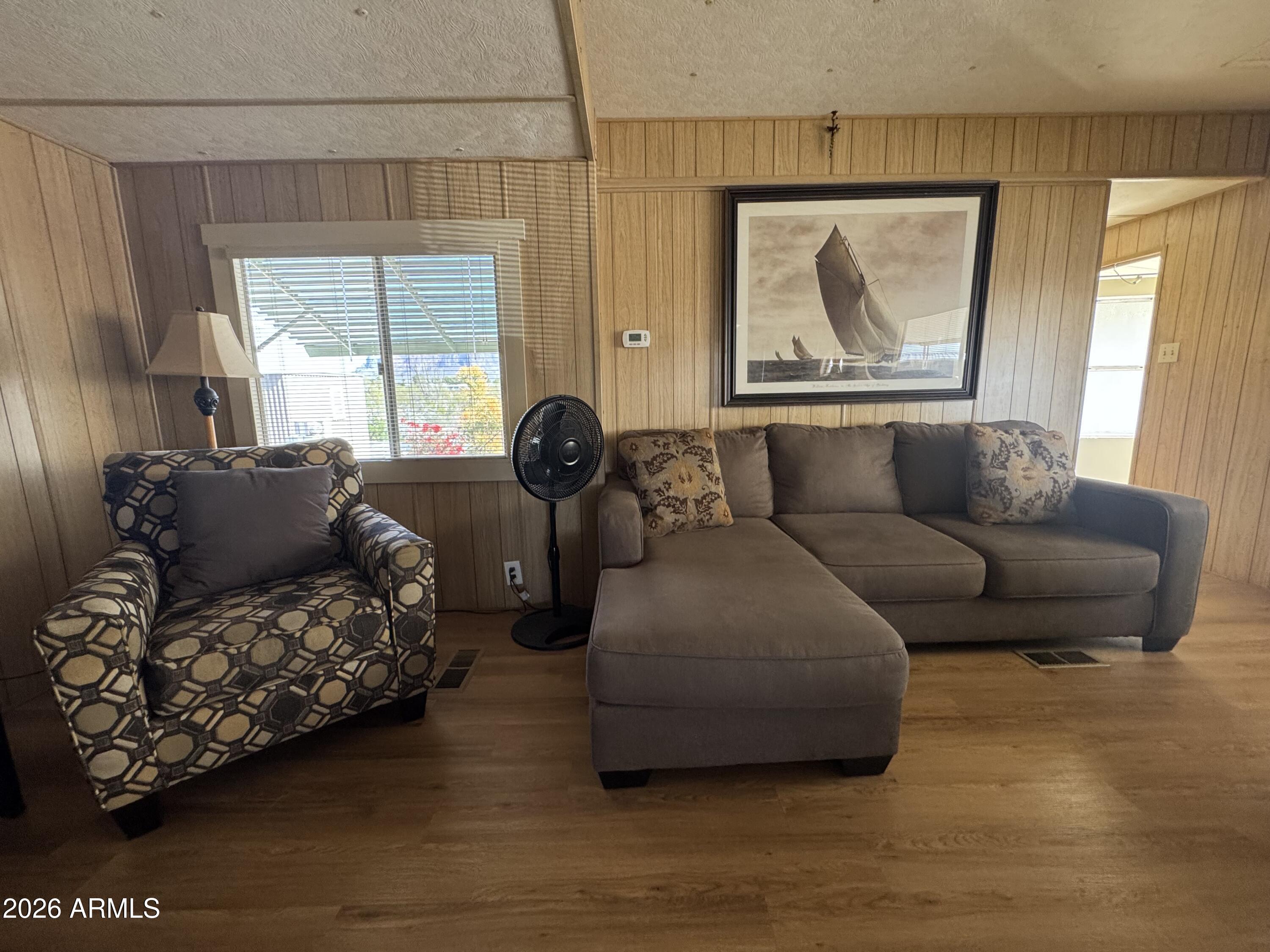 269 North Winchester Road, Unit 36 Apache Junction, AZ 85119 - Photo 6 of 19 a living room with furniture and a large window