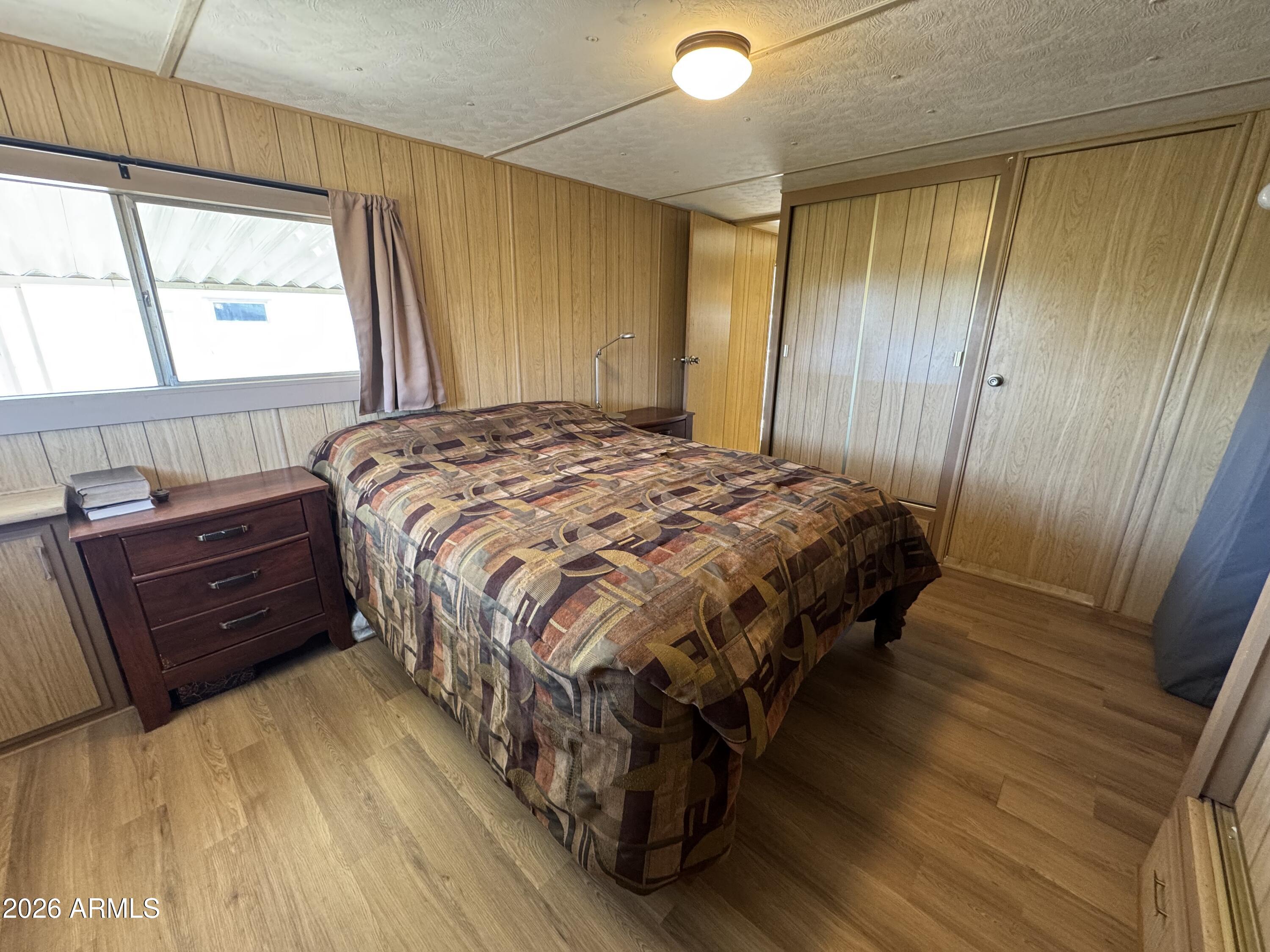 269 North Winchester Road, Unit 36 Apache Junction, AZ 85119 - Photo 9 of 19 a bedroom with a bed and a window