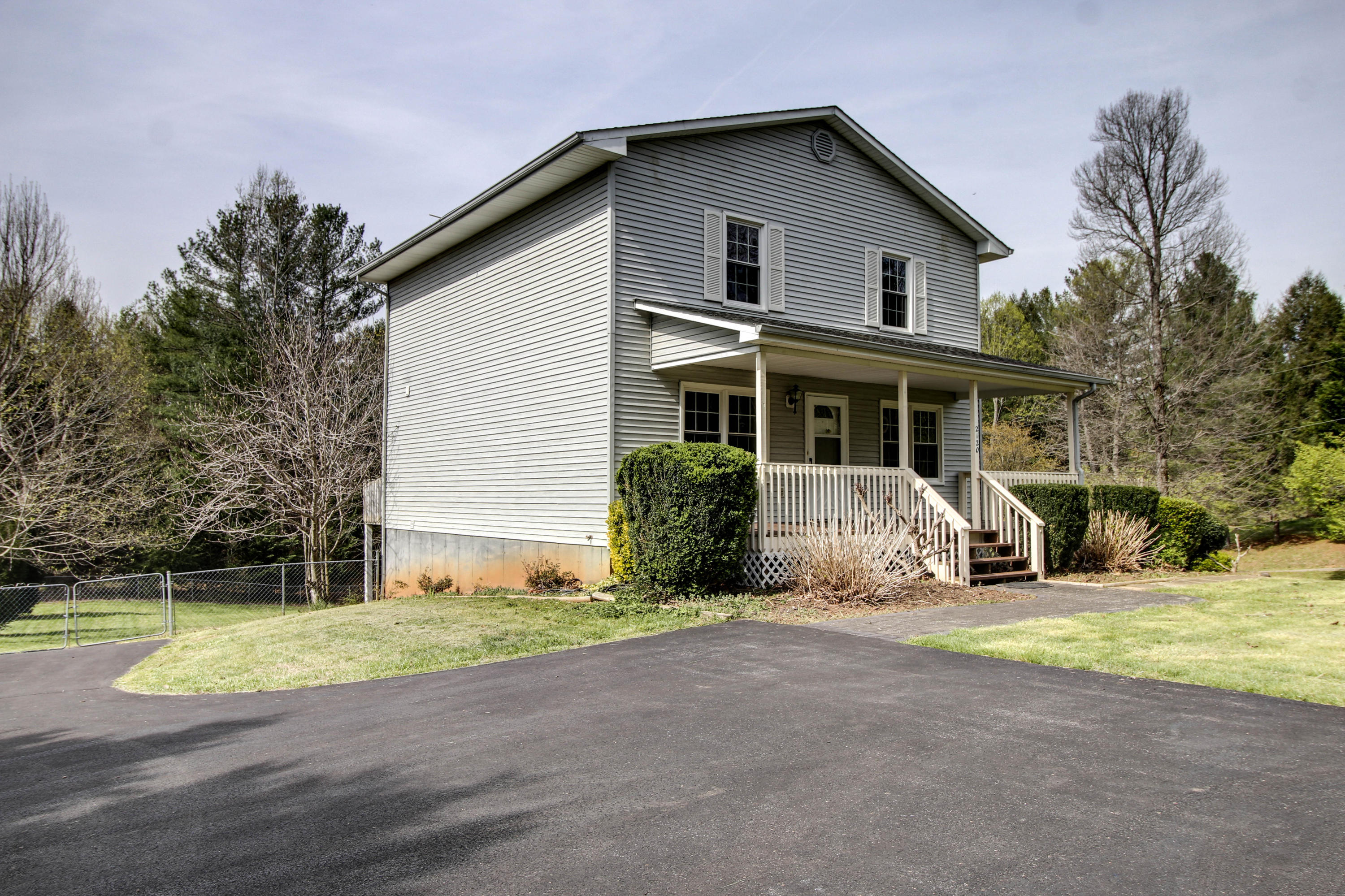 2120 Dugspur Road Callaway, VA 24067 - Photo 2 of 40 a view of a house with backyard and trees