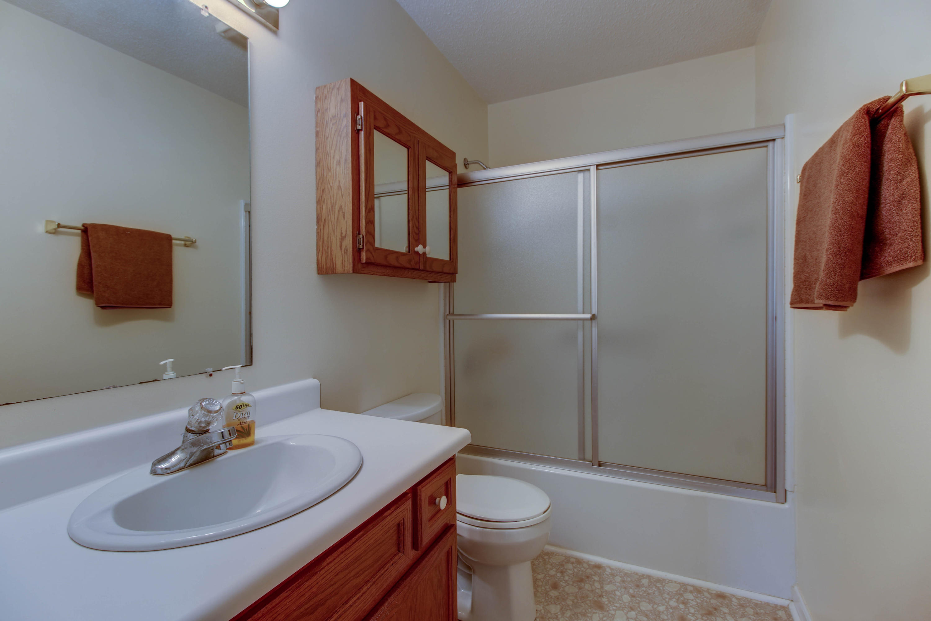 2120 Dugspur Road Callaway, VA 24067 - Photo 18 of 40 a bathroom with a sink a toilet and shower