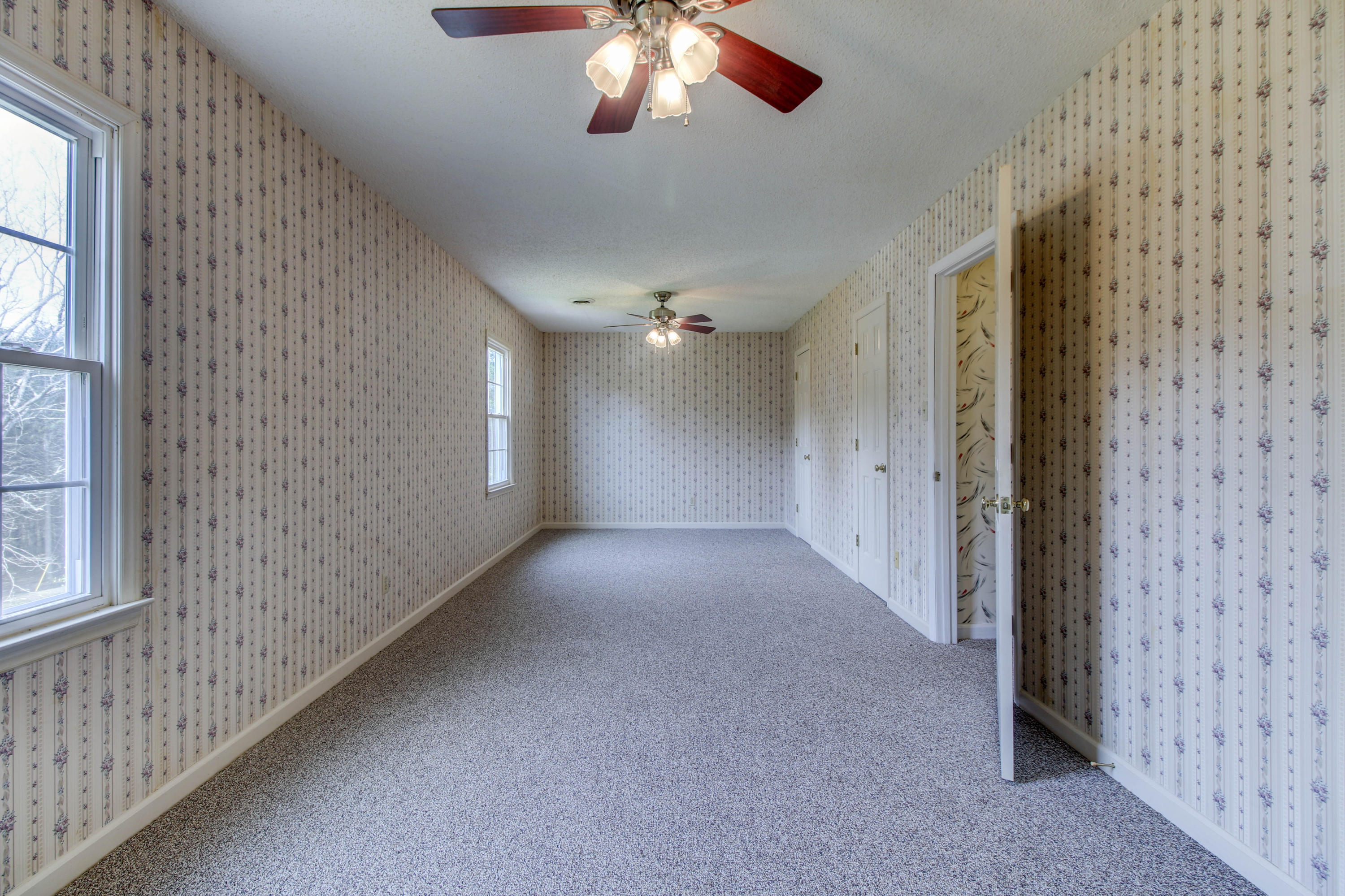 2120 Dugspur Road Callaway, VA 24067 - Photo 23 of 40 a view of a livingroom with a ceiling fan and window
