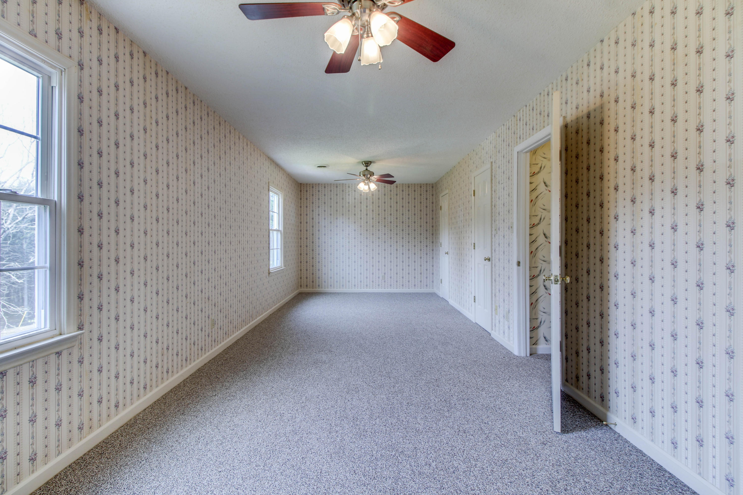 2120 Dugspur Road Callaway, VA 24067 - Photo 24 of 40 a view of a livingroom with a ceiling fan and window