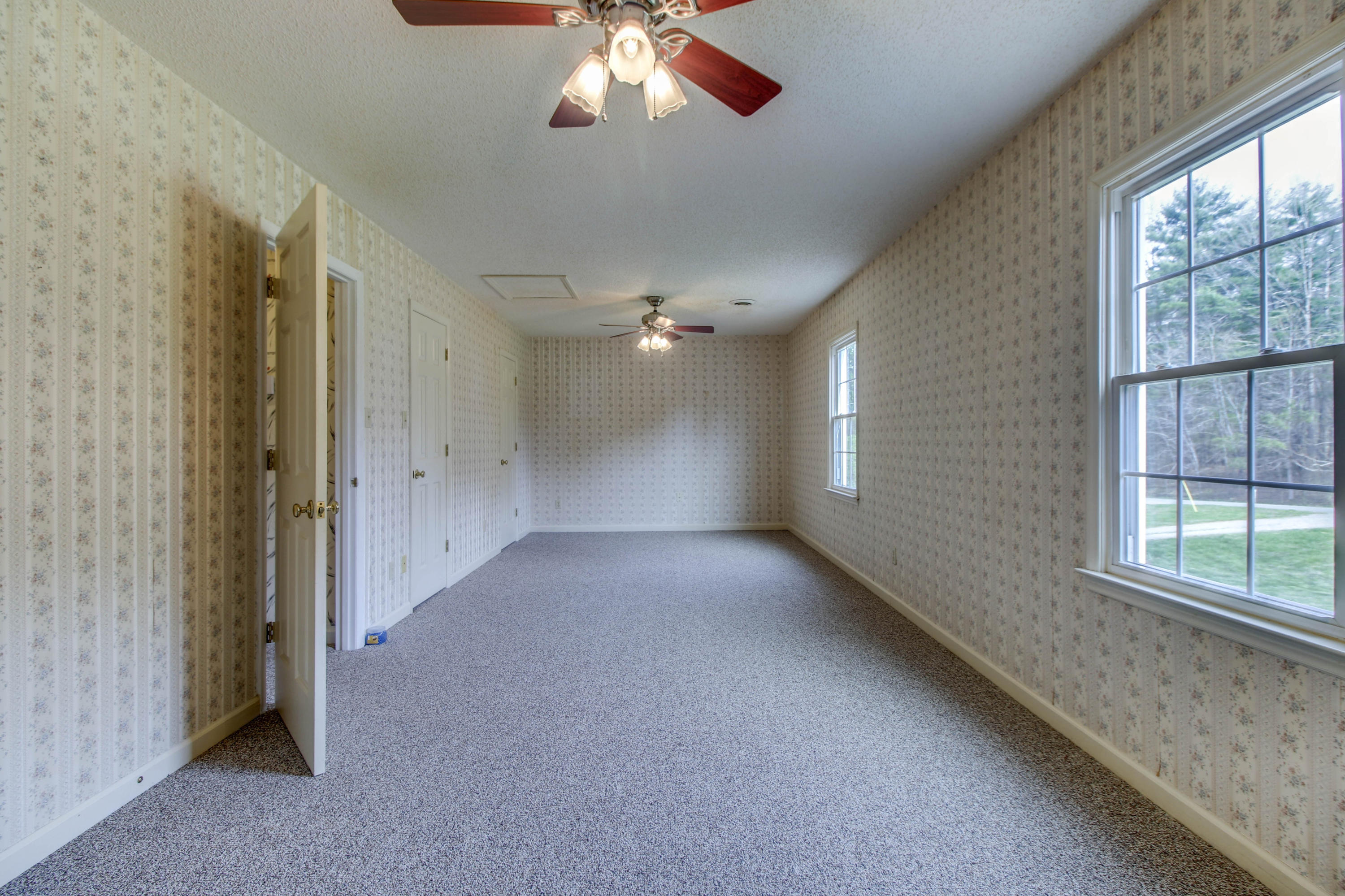 2120 Dugspur Road Callaway, VA 24067 - Photo 25 of 40 a view of a livingroom with a ceiling fan and window