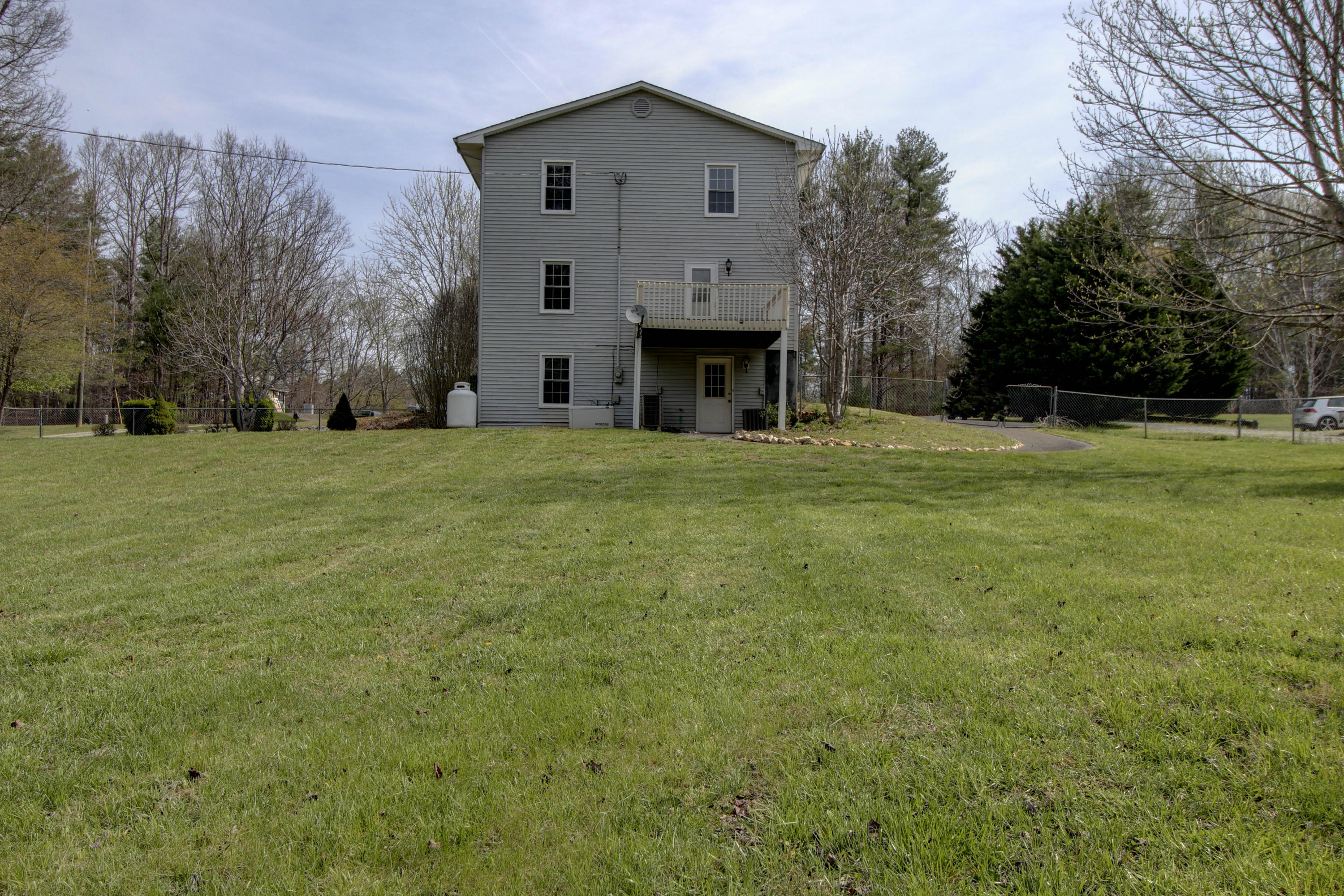 2120 Dugspur Road Callaway, VA 24067 - Photo 38 of 40 a front view of house with yard and trees in the background