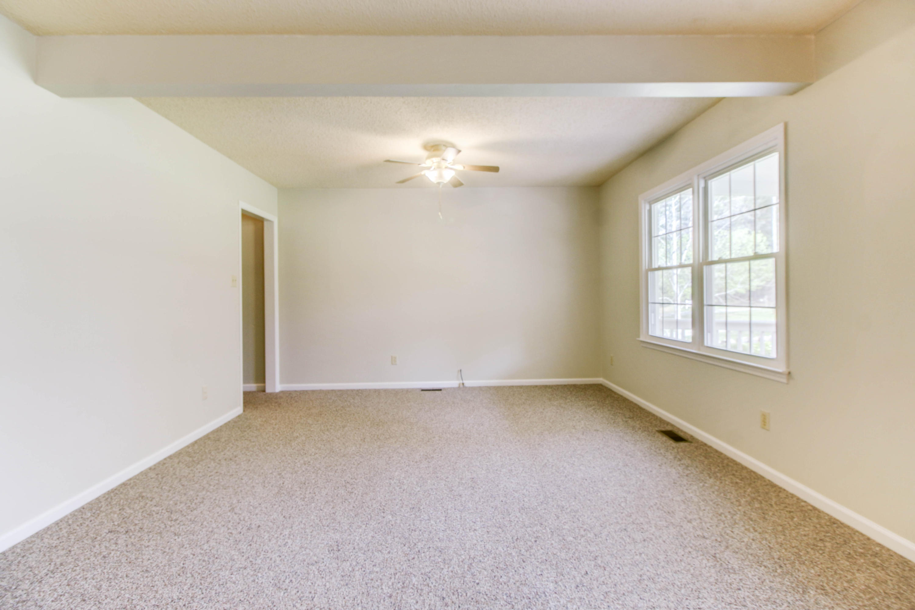 2120 Dugspur Road Callaway, VA 24067 - Photo 5 of 40 an empty room with a window and a ceiling fan