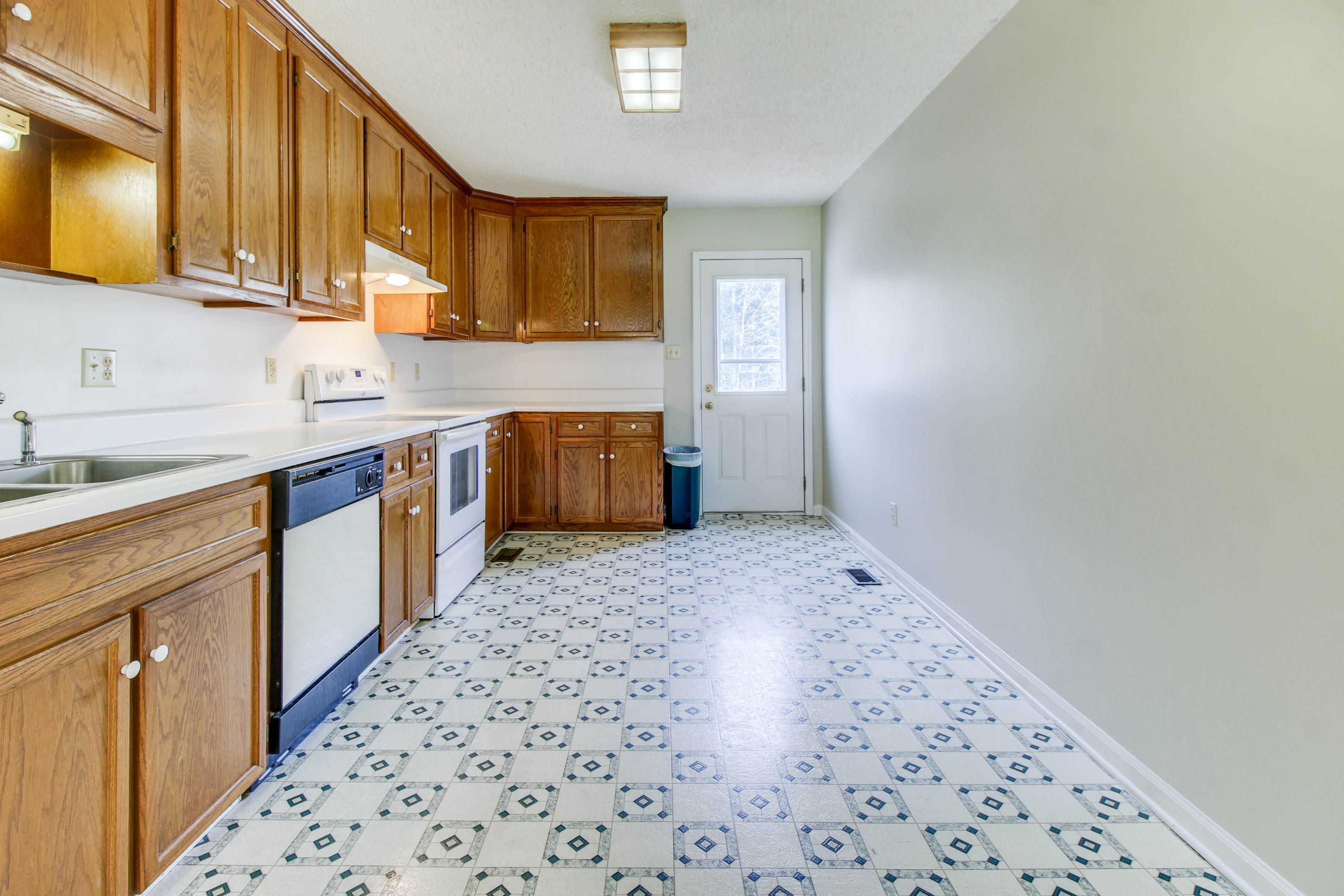 2120 Dugspur Road Callaway, VA 24067 - Photo 7 of 40 a kitchen with sink cabinets and window
