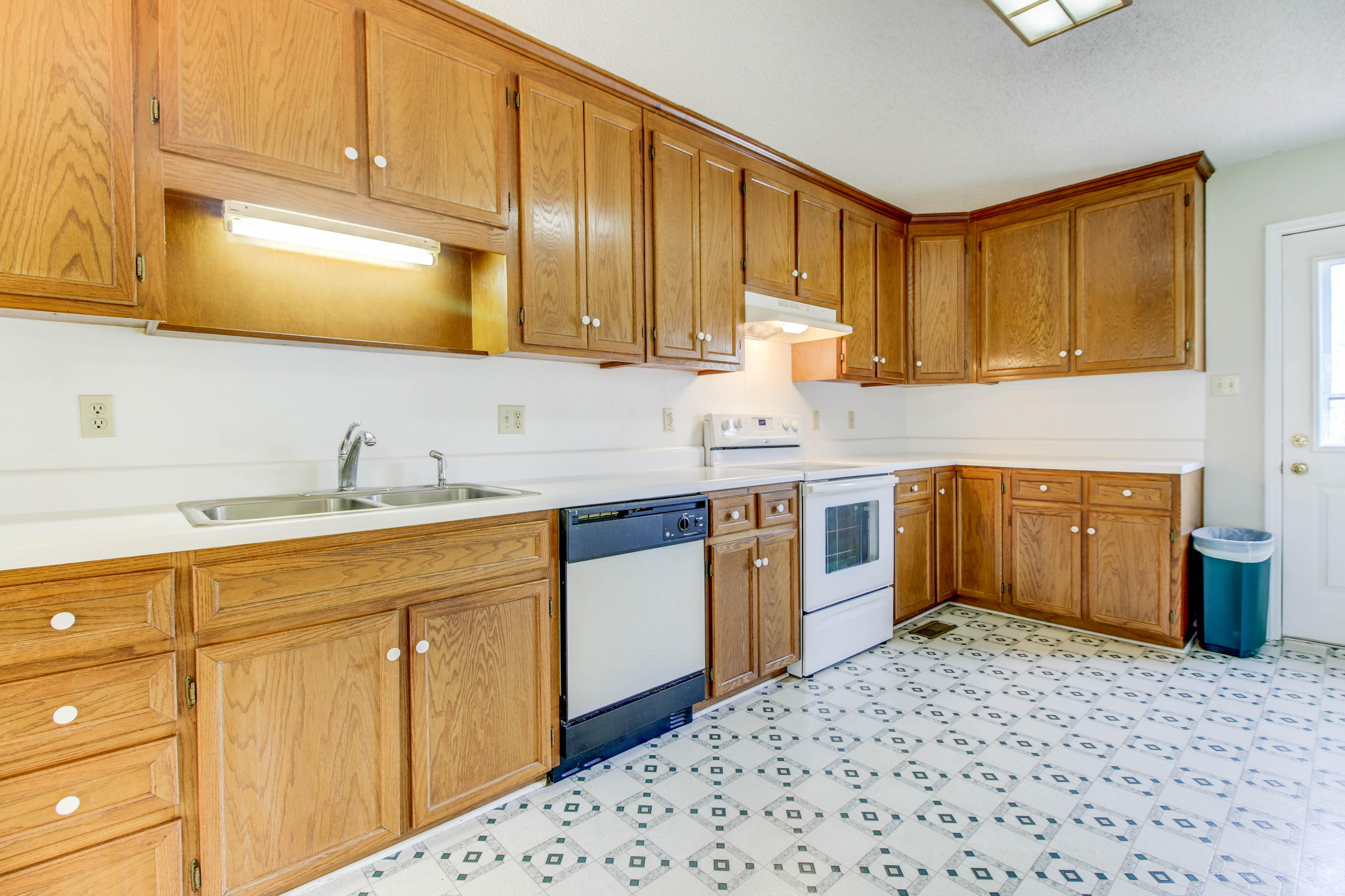 2120 Dugspur Road Callaway, VA 24067 - Photo 8 of 40 a kitchen with stainless steel appliances wooden cabinets and a sink