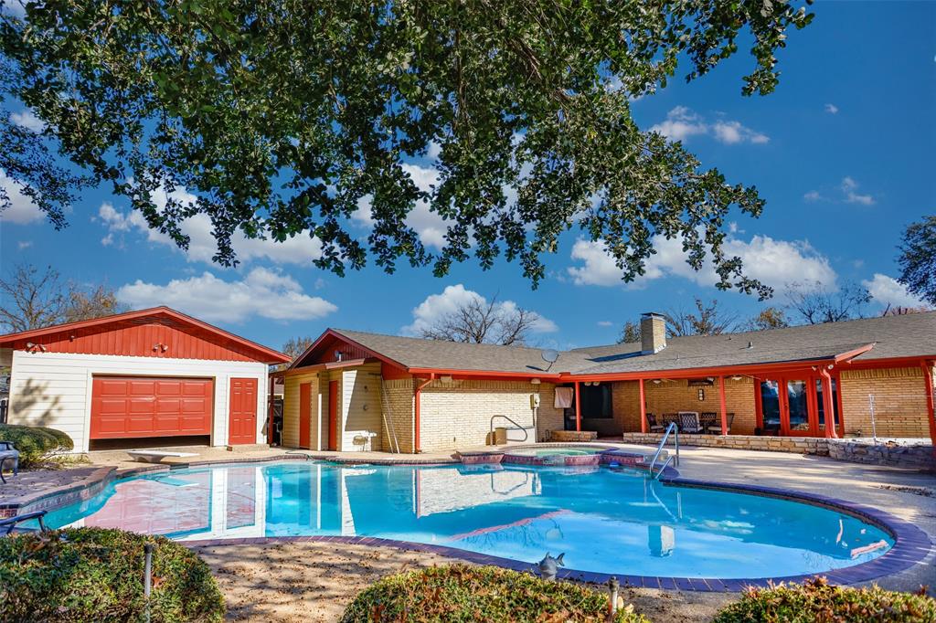 a front view of house with yard and car parked