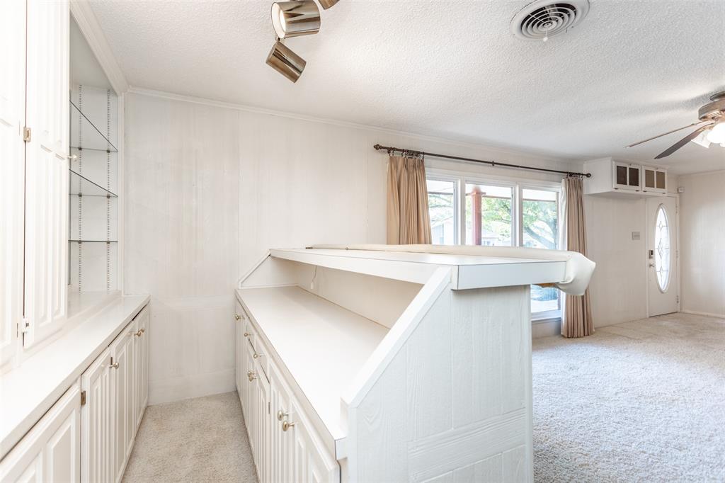 417 Willow Way Gainesville, TX 76240 - Photo 18 of 40 a kitchen with a sink stove and cabinets