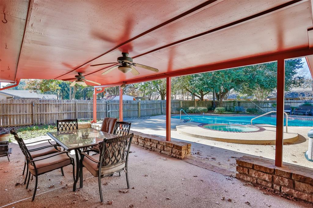 417 Willow Way Gainesville, TX 76240 - Photo 3 of 40 a view of a patio with a table chairs and a backyard