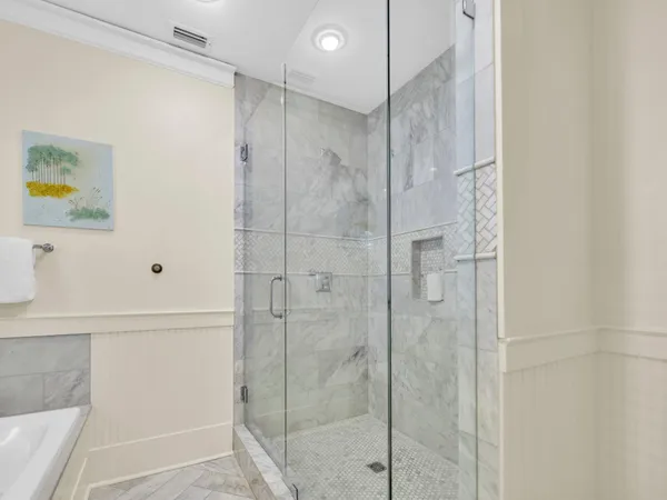 a bathroom with a shower and a sink