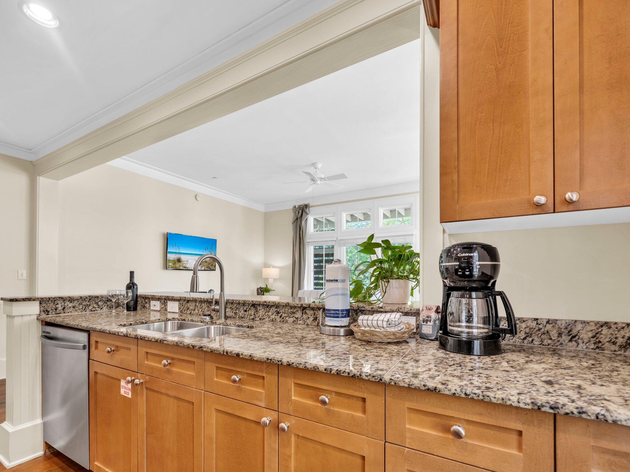 1660 East County Highway 30A, Unit 102 Santa Rosa Beach, FL 32459 - Photo 24 of 48 a kitchen with sink and cabinets