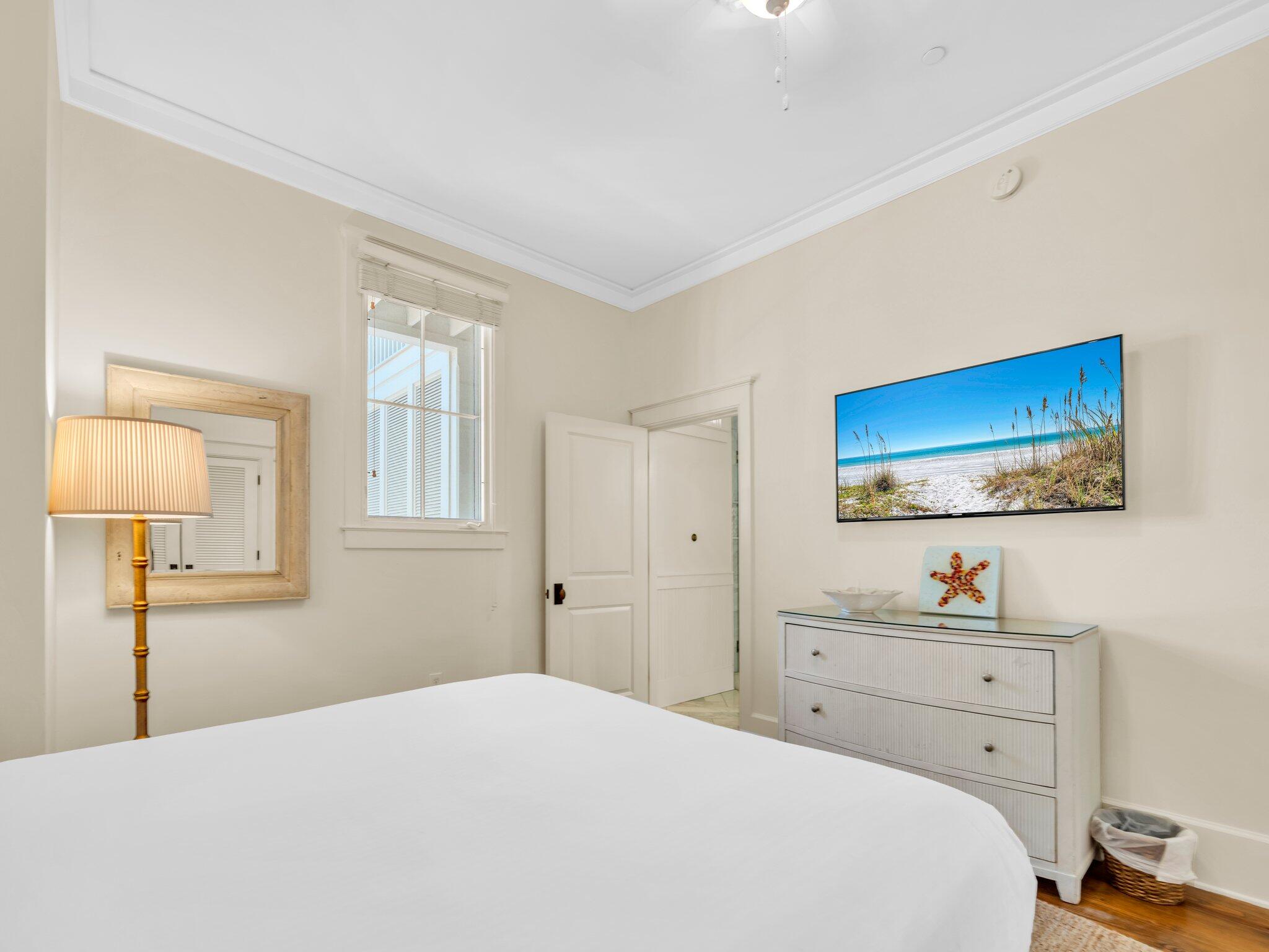 1660 East County Highway 30A, Unit 102 Santa Rosa Beach, FL 32459 - Photo 26 of 48 a bedroom with a bed and a window