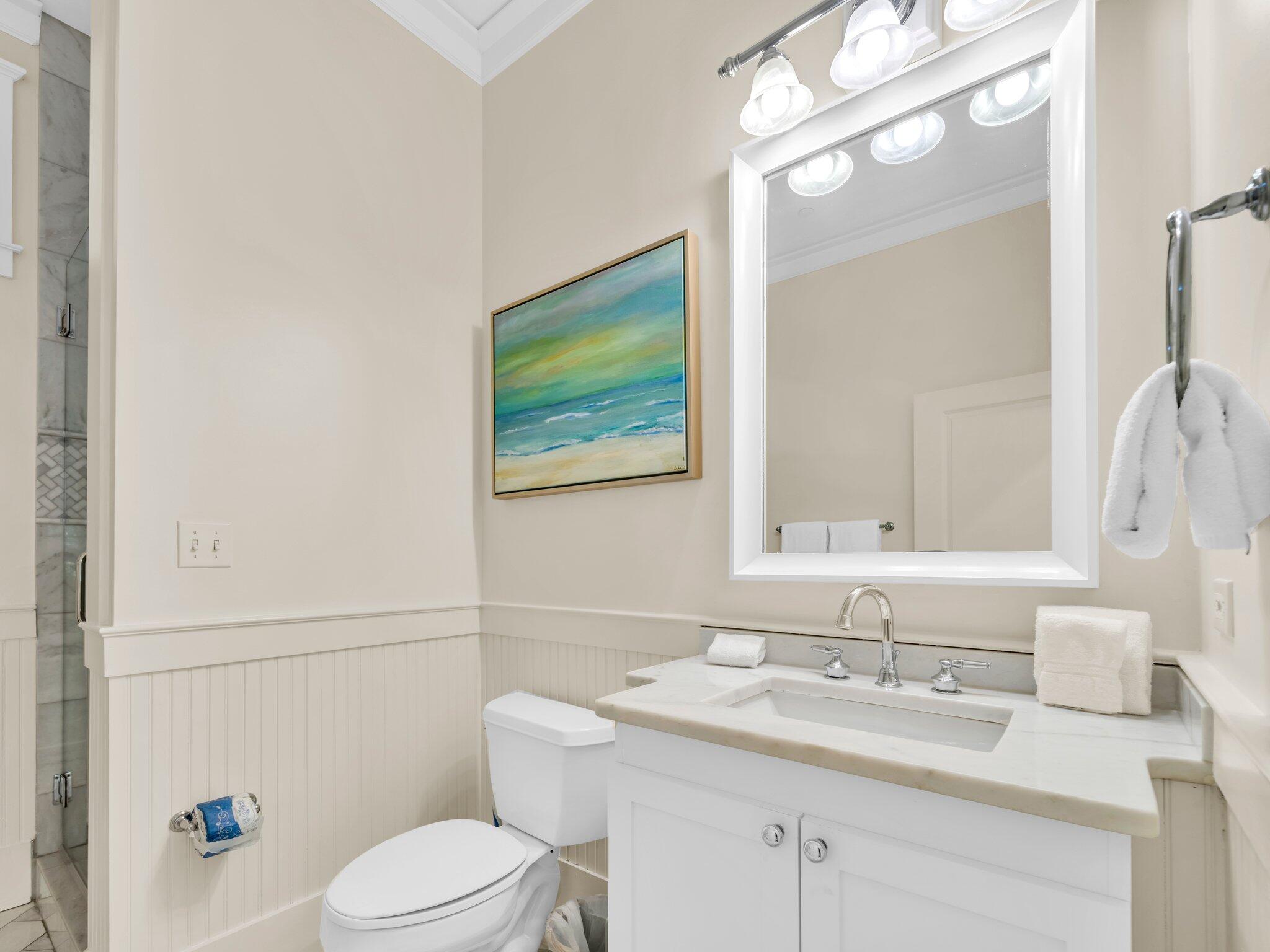 1660 East County Highway 30A, Unit 102 Santa Rosa Beach, FL 32459 - Photo 28 of 48 a bathroom with a granite countertop sink mirror vanity and toilet