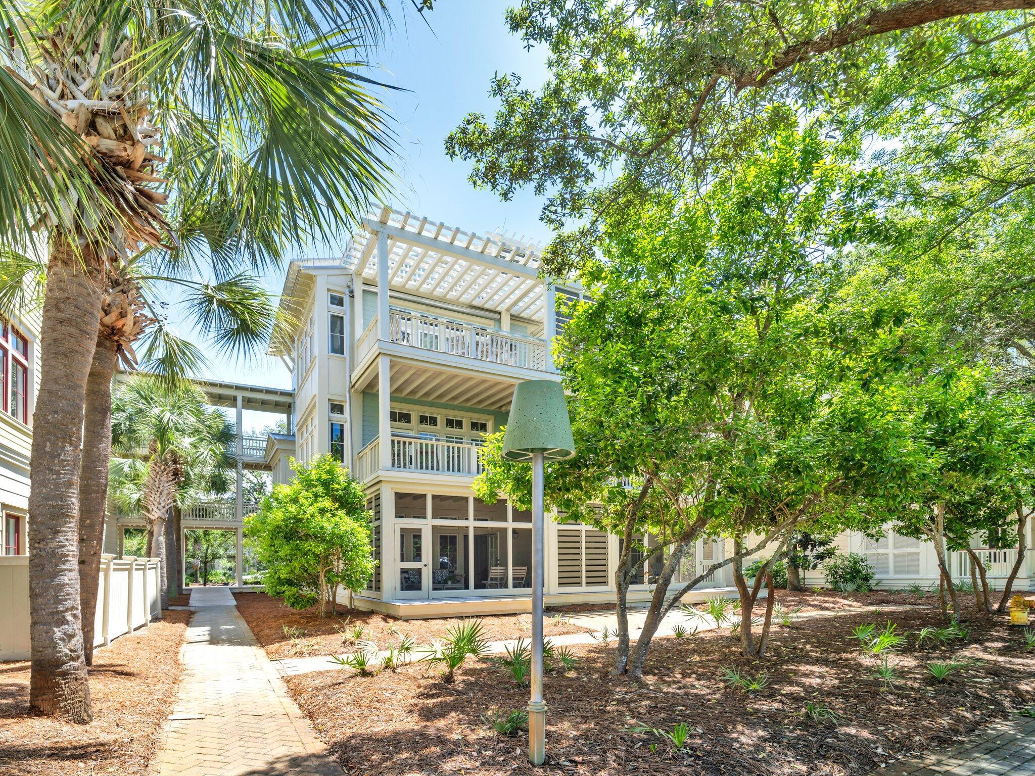1660 East County Highway 30A, Unit 102 Santa Rosa Beach, FL 32459 - Photo 34 of 48 a view of a building with a tree