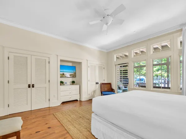 a bedroom with a large bed and a window
