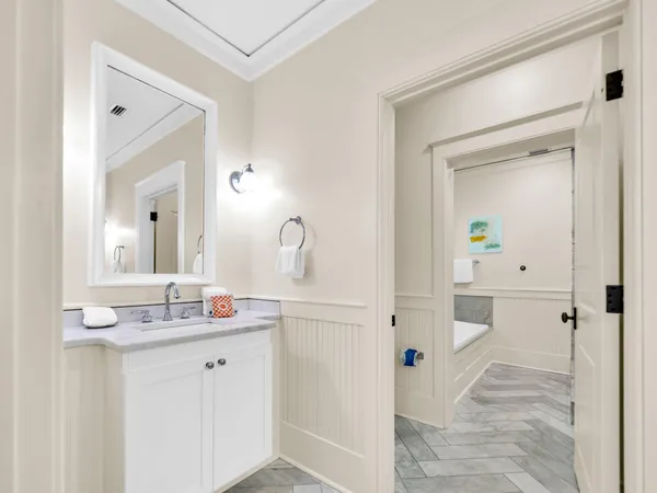 a bathroom with a sink and mirror