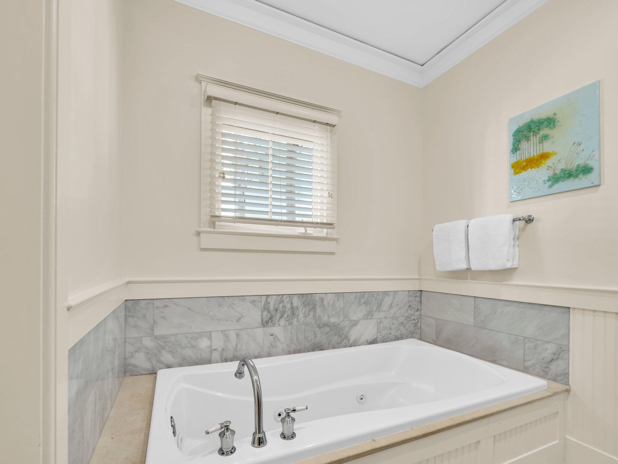 1660 East County Highway 30A, Unit 102 Santa Rosa Beach, FL 32459 - Photo 10 of 48 a bathroom with a bathtub