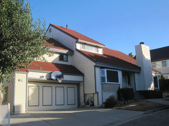 a view of a house with a street