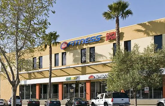 a front view of a building with tree s