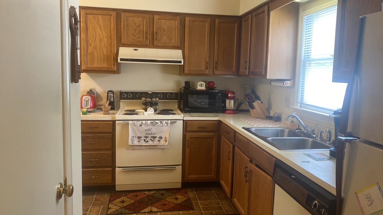700 Rife Road, Unit 7F Waynesboro, VA 22980 - Photo 11 of 20 a kitchen with stainless steel appliances granite countertop a refrigerator sink and cabinets