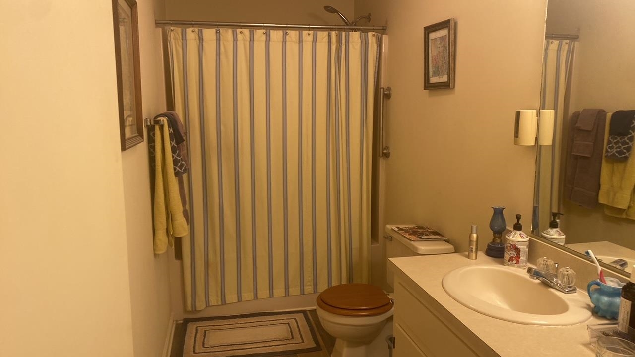 700 Rife Road, Unit 7F Waynesboro, VA 22980 - Photo 15 of 20 a bathroom with a sink a toilet and shower curtain