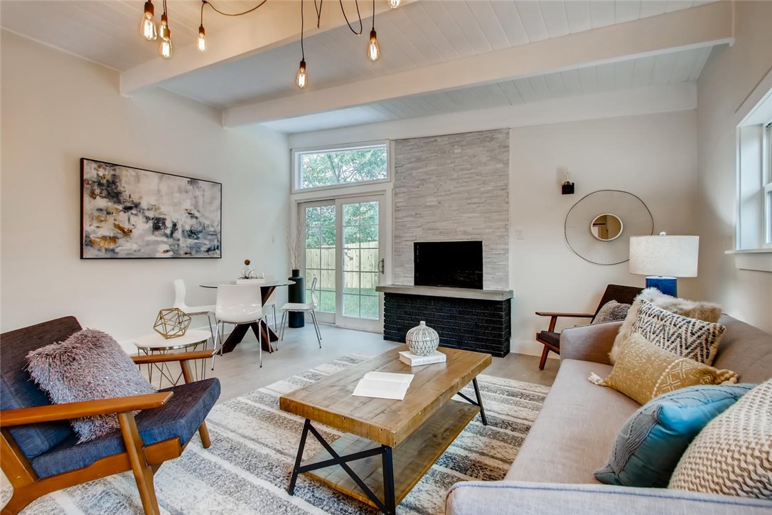1600 Meander Drive Austin, TX 78721 - Photo 1 of 1 a living room with furniture and a flat screen tv