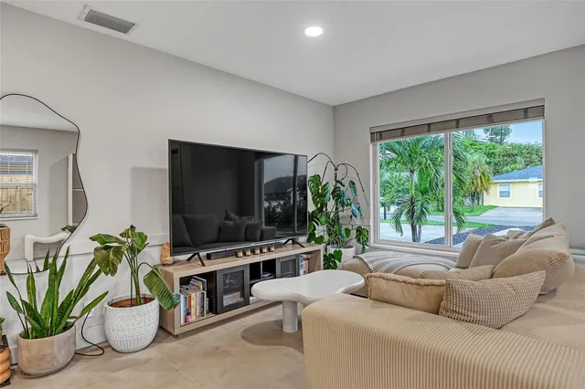 a kitchen that has a sink cabinets and stainless steel appliances