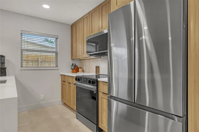 a bathroom with a sink a vanity and a large mirror