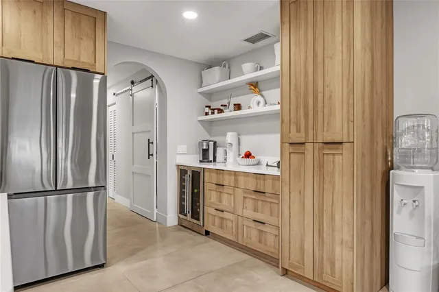 a view of a hallway with washer and dryer