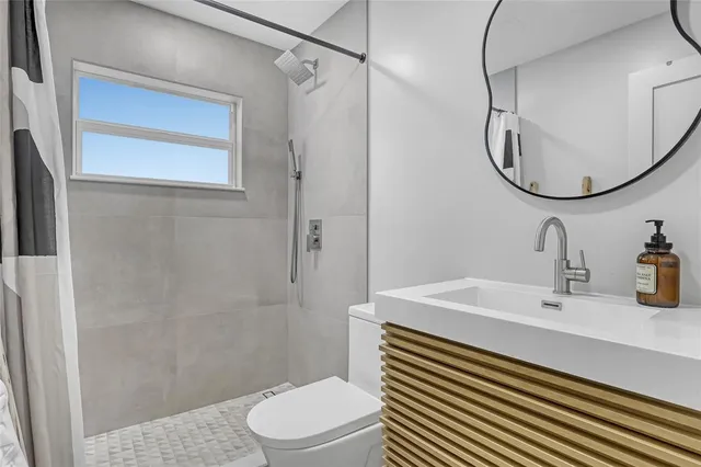 a view of a livingroom with furniture and a flat screen tv