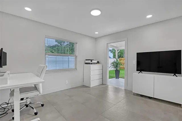 a view of a workspace with furniture