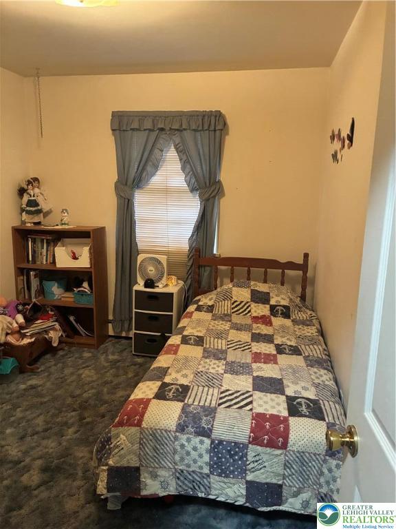 195 Bangor Junction Road Bangor, PA 18013 - Photo 11 of 16 a bedroom with a bed and a mirror