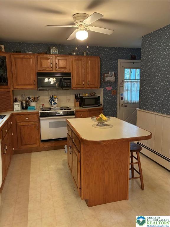 195 Bangor Junction Road Bangor, PA 18013 - Photo 3 of 16 a kitchen with stainless steel appliances granite countertop a sink a stove and a refrigerator