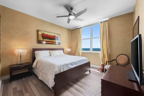 a bedroom with a large bed and a window