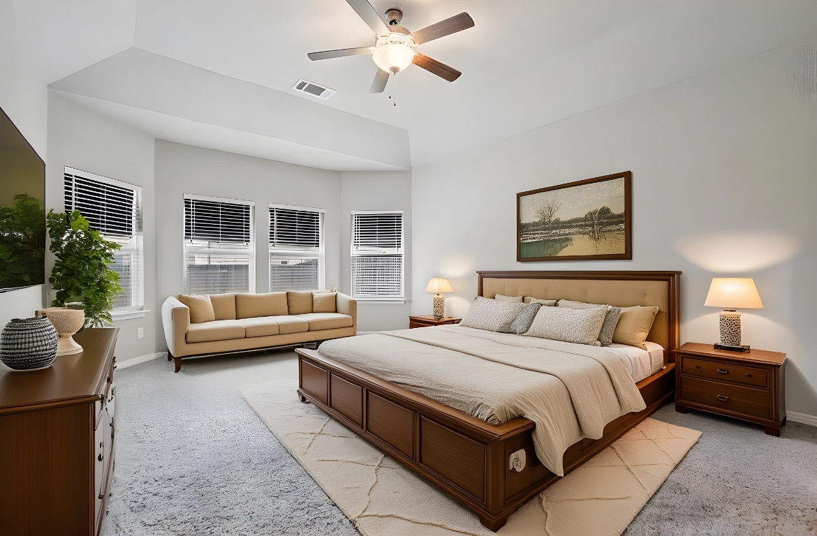 1007 Guadalupe Bass Road Hutto, TX 78634 - Photo 15 of 39 Virtual Staged Bedroom with light colored carpet and a ceiling fan
