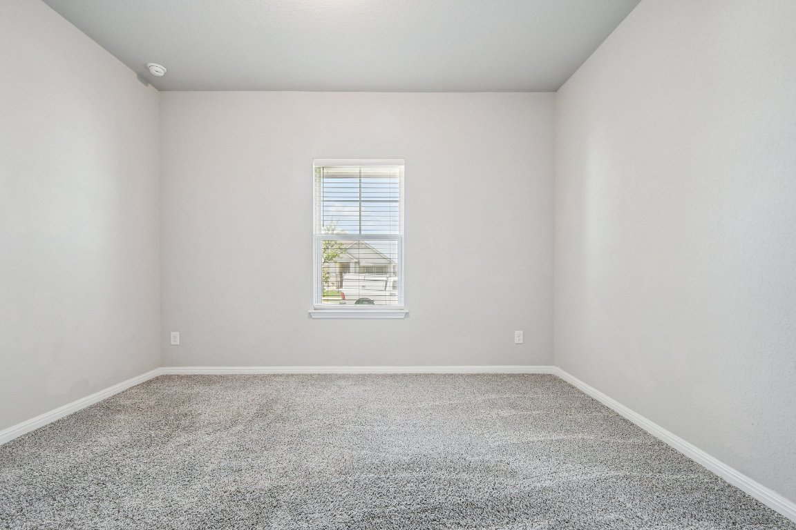 1007 Guadalupe Bass Road Hutto, TX 78634 - Photo 17 of 39 Spare room with carpet
