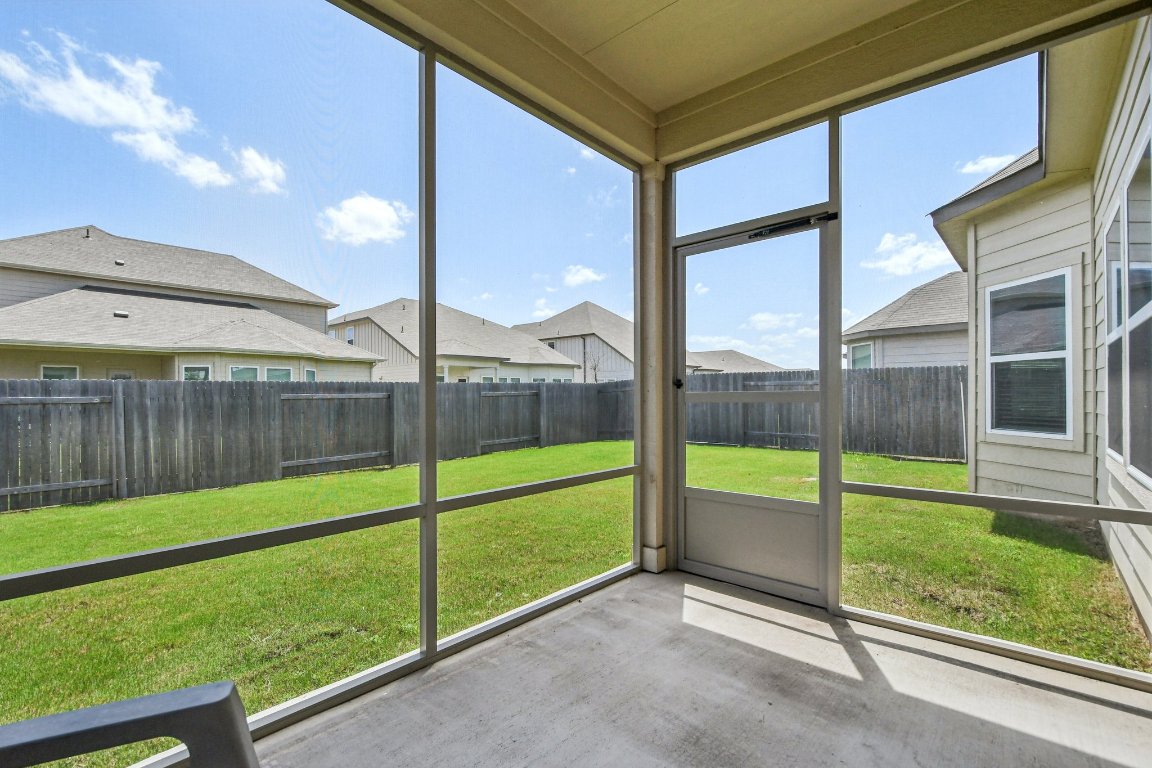 1007 Guadalupe Bass Road Hutto, TX 78634 - Photo 33 of 39 Unfurnished sunroom with a residential view