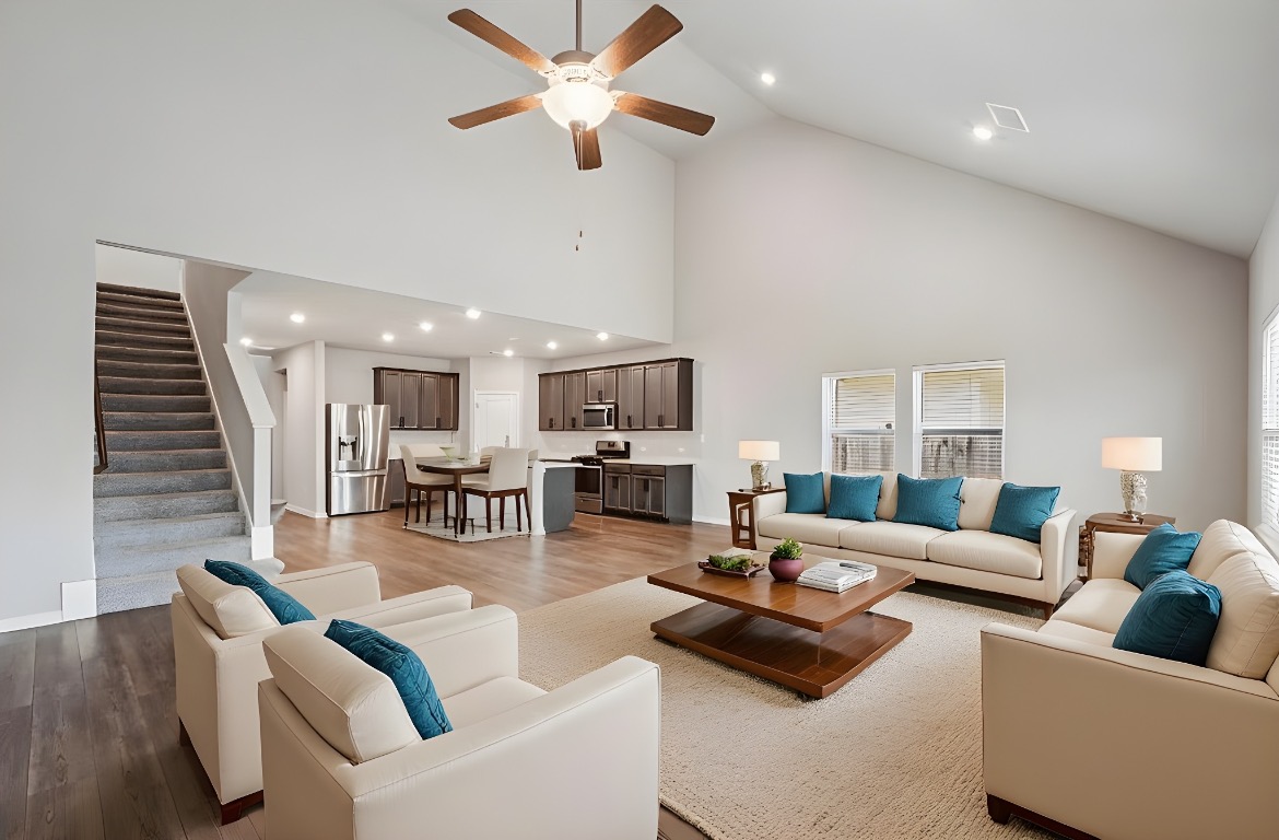 1007 Guadalupe Bass Road Hutto, TX 78634 - Photo 4 of 39 Virtual Staged Living room featuring high vaulted ceiling, recessed lighting, light wood-style floors, stairs, and ceiling fan
