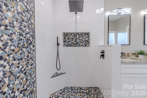 a bathroom with a shower curtain and a sink