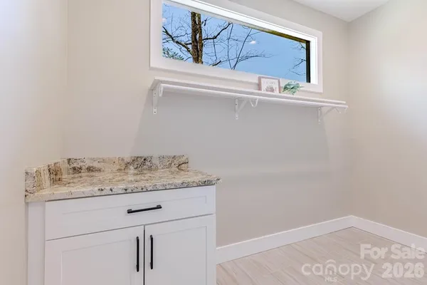 a bathroom with a sink and vanity