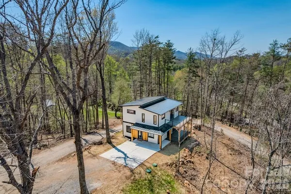 a view of a park with large trees