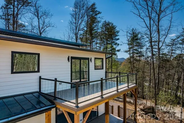 a view of a house with large trees