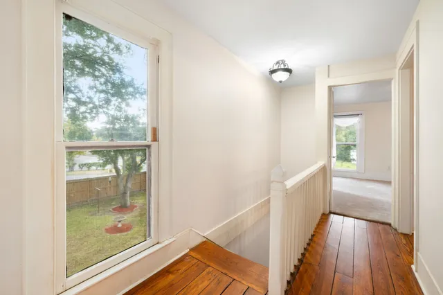 a view of front door with wooden floor
