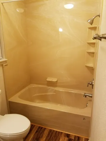 a view of a garden with a building in the background