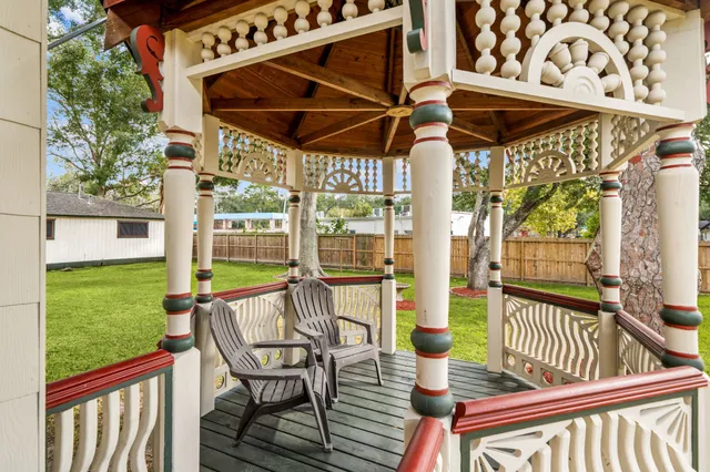 a view of a chair and table in the garden