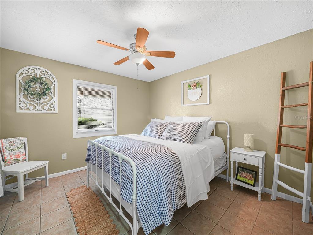 3963 Mammoth Grove Road Lake Wales, FL 33898 - Photo 25 of 42 a bedroom with a bed and a window