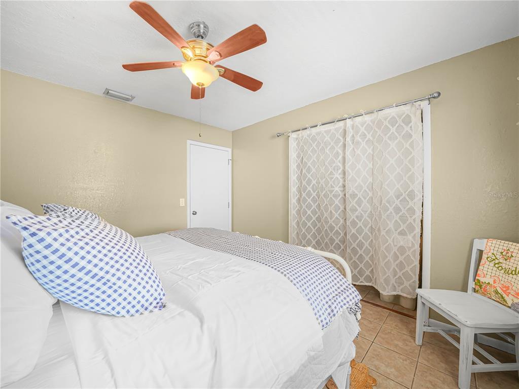 3963 Mammoth Grove Road Lake Wales, FL 33898 - Photo 26 of 42 a bedroom with a bed and window