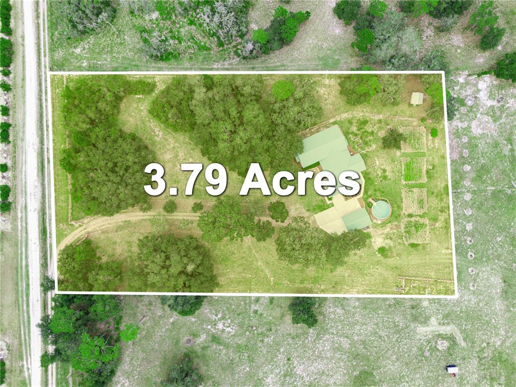 3963 Mammoth Grove Road Lake Wales, FL 33898 - Photo 3 of 42 a view of a sign room with a small yard